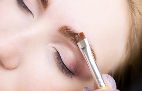 eyebrow lamination procedure using components applying hair dye to the eyebrows of the model